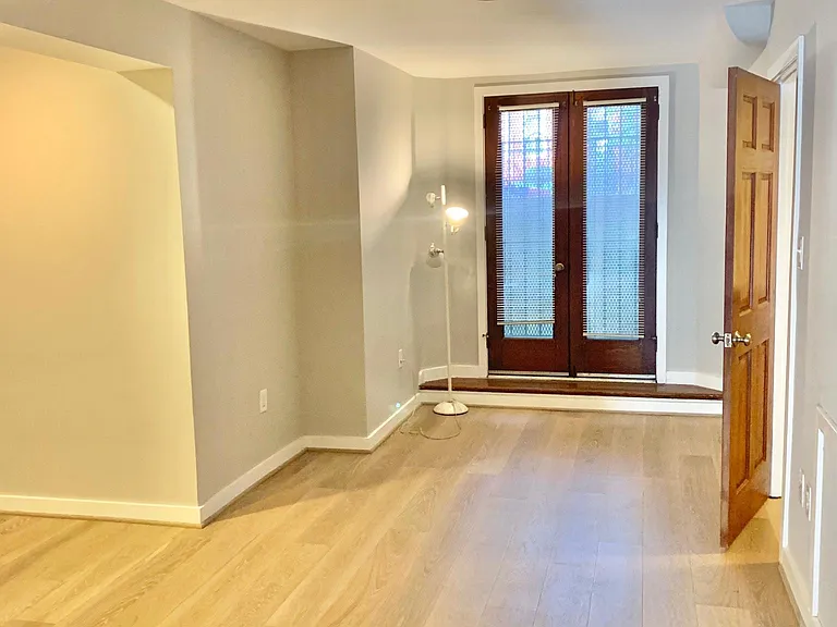 Alcove for bed on the left and room for desk and dressers.