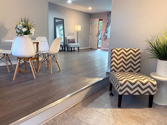 Step-down den/office/family room looking through dining area and living room.