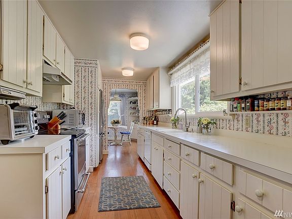 Loads of storage and light in this charming vintage kitchen