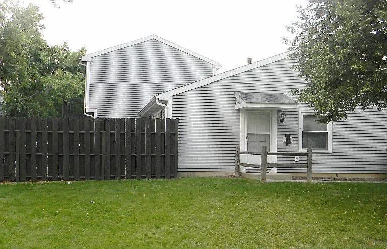 side of unit and fence