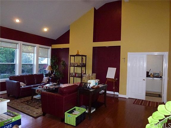 Elegant and spacious living room. Large windows lets in lots of sun light.