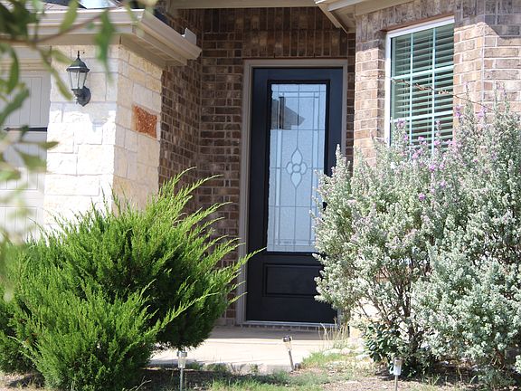 Enjoy the curb appeal with this lush greenery.