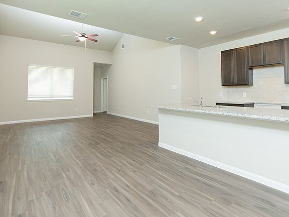 Dining Area to Kitchen and Family Room