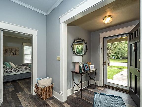 Pretty entry way, walk into trendy and cool greys!  See the open flow of the home as soon as you walk in.