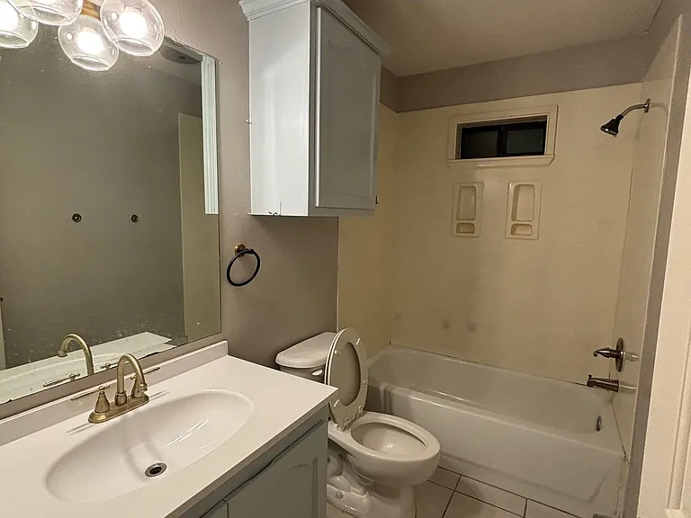 Common toilet and bath close to second bedroom and living area