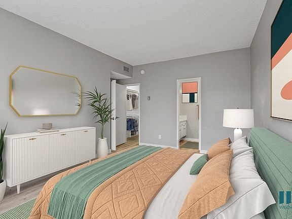 Bedroom with Walk-In Closet, Bathroom, and Vinyl Flooring