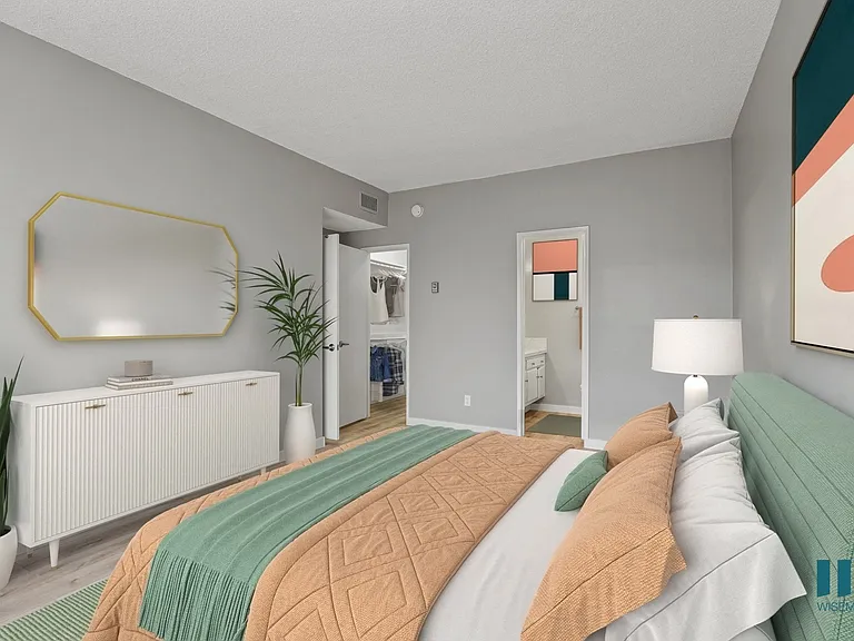 Bedroom with Walk-In Closet, Bathroom, and Vinyl Flooring