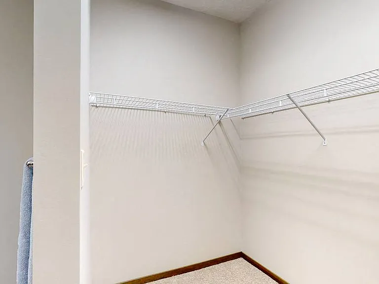 You'll love the abundant storage in the master closet in the Cedar floor plan.
