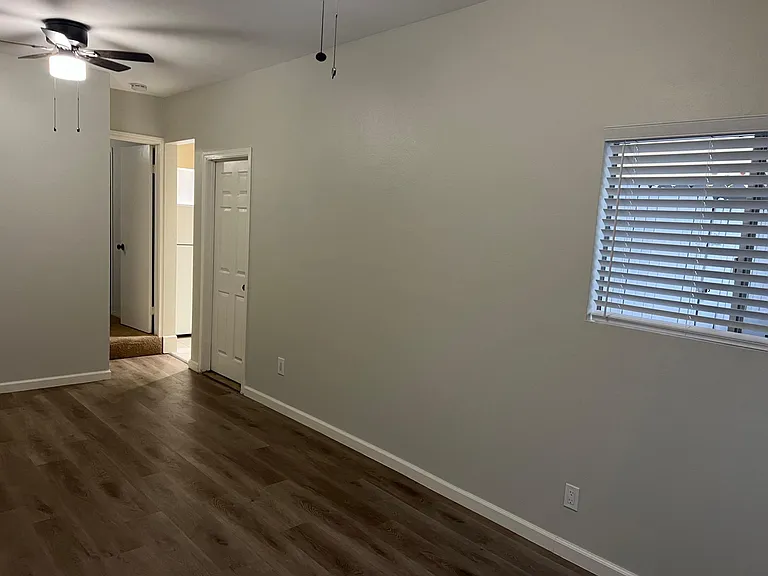 Dining area view from living room combo area. First door is to outside covered patio. Second door is to step save kitchen.
