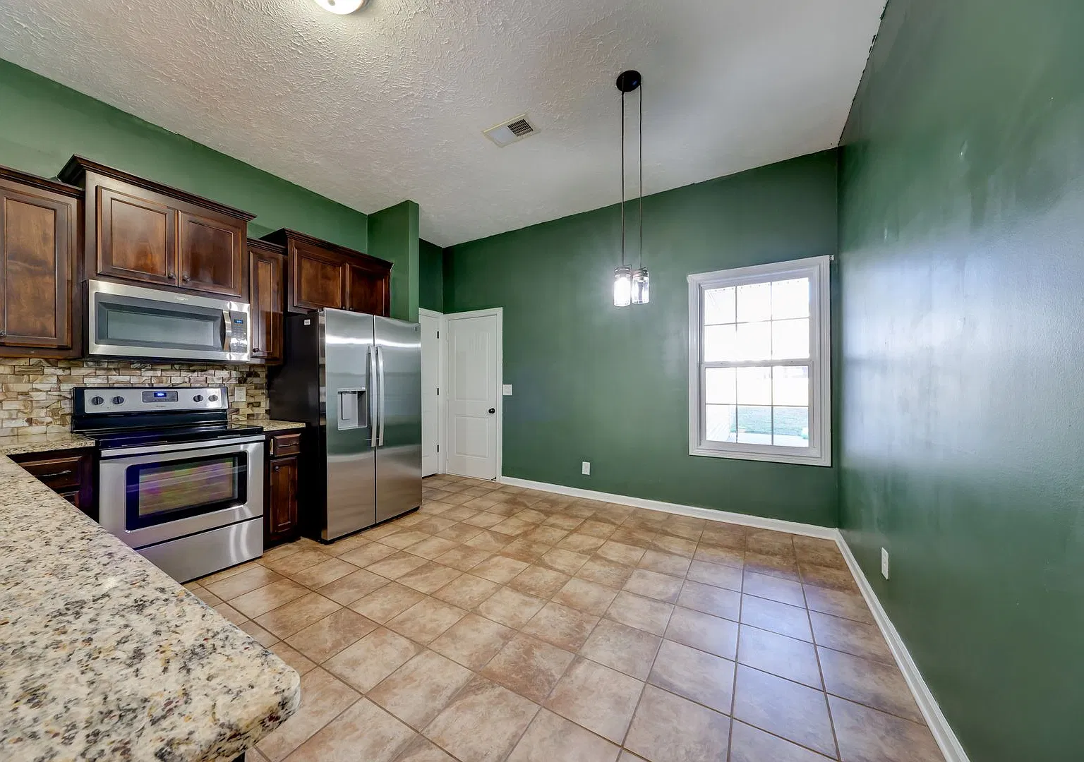 Inviting Home with Fireplace & Fenced Backyard — Photo 4