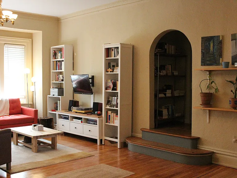 Alternate view of living room and stairs to second floor bedrooms.