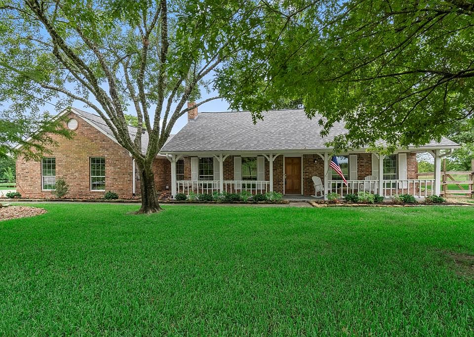 Welcome Home to this gorgeous updated home on 5 acres with a view of Lake Conroe.