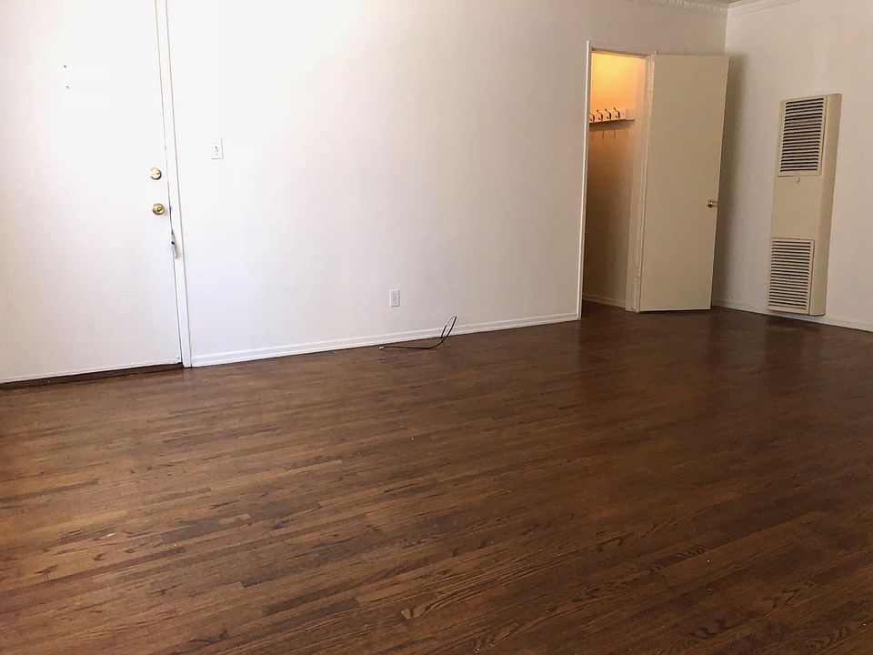 Living Room Showing Large Storage Closet and Front Door