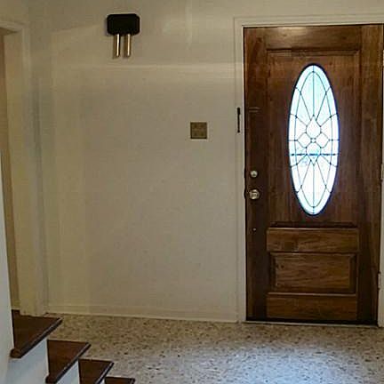 Entry way, with stairs leading upstairs.