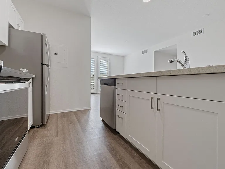Modern kitchens with stainless steel appliances and white cabinets