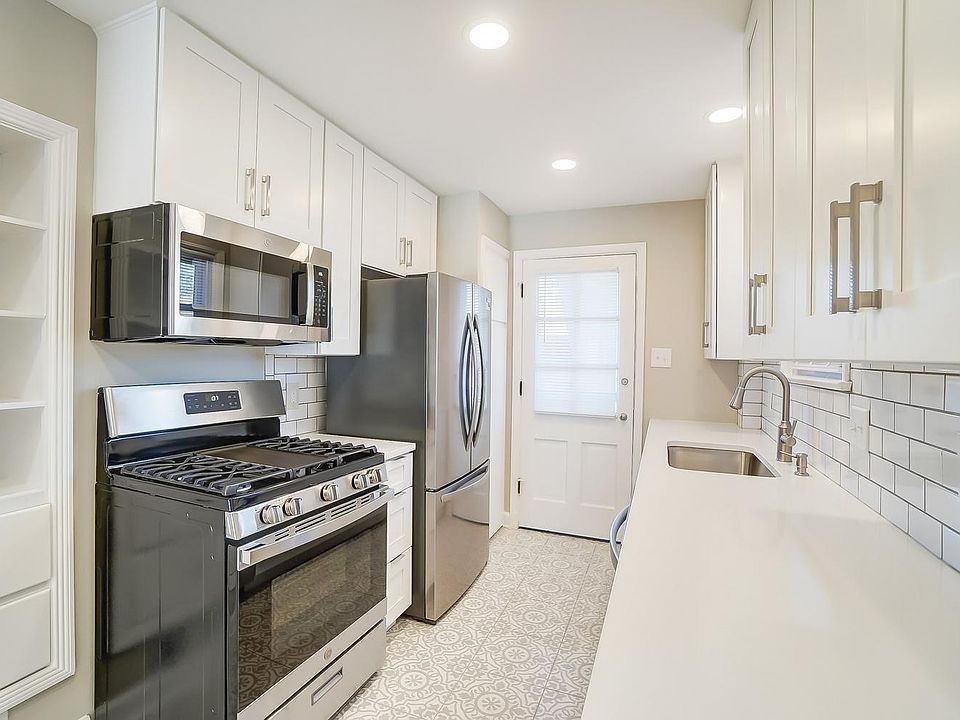 New stainless appliances; dishwasher, microwave, gas stove and refrigerator with ice maker.