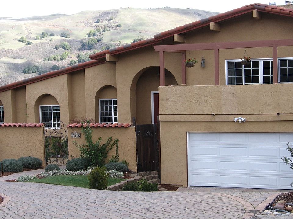 Elegant home sits on just under 1/2 landscaped acre