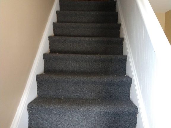Steps up to the upper 1 bedroom unit.