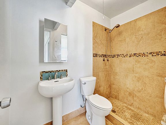 Clean, private bathroom with updated fixtures.