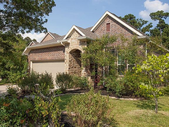Extensive landscaping offers a welcoming curb appeal...