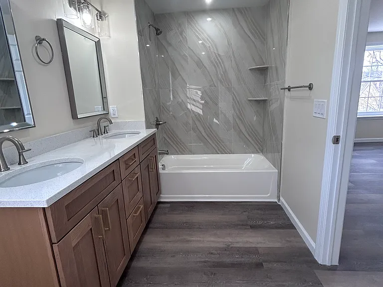 Primary Bathroom is roomy with double sinks and beautiful finishes.