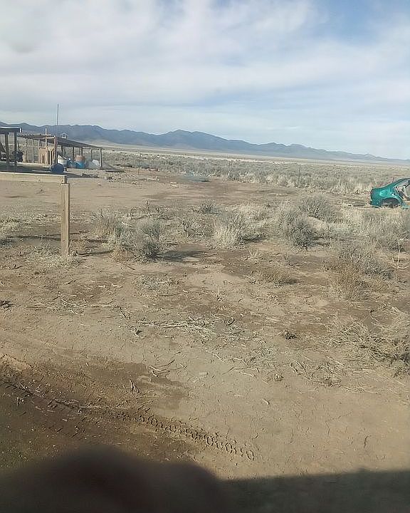 To the right side of propert