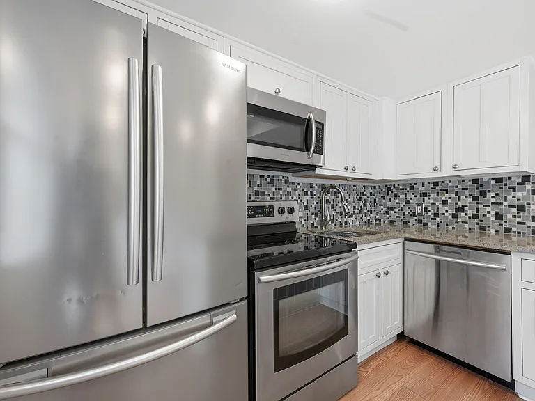 Updated Kitchen including Stainless Steel Appliances and White Cabinetry