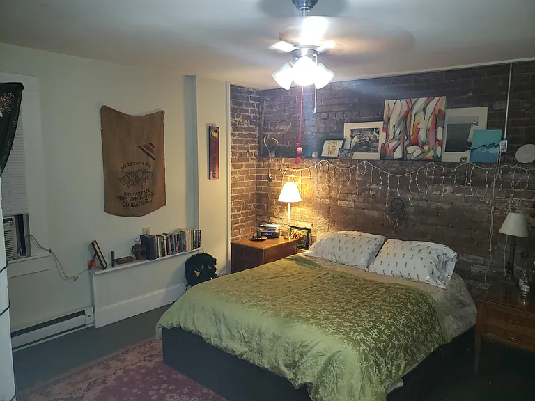 Bedroom with exposed brick accent wall