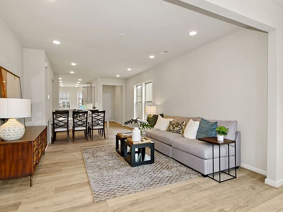 Model Representation - Open Floor Plan Showcasing the Dining Space and Gathering Room