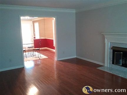 Living room with gas burning logs.