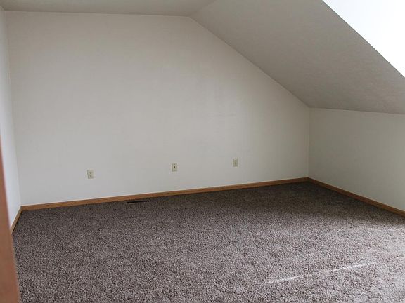 Upstairs bedroom with a bathroom and walk in closet