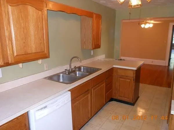 Modern updated Kitchen: New Refrigerator, Gas Stove, Dishwasher, ceramic tile backsplash, new fixtures.