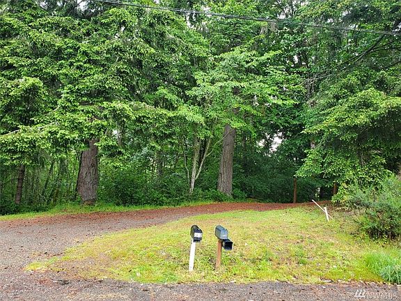 SW Corner Stake near the street is to the right of the mailboxes