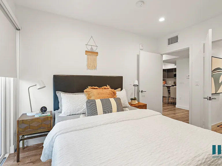 Bedroom with Private Entrance, Bathroom, and Mirrored Closet