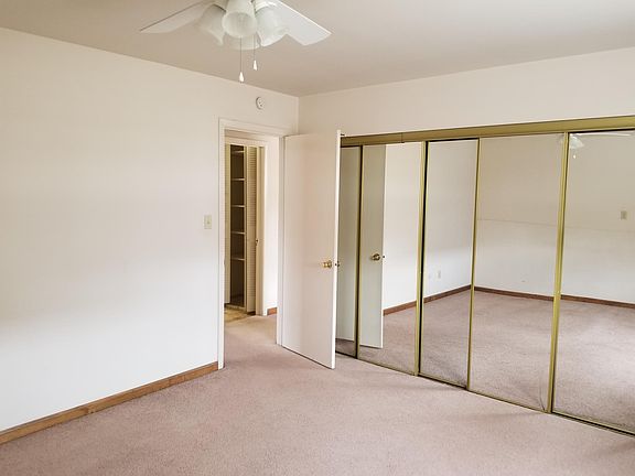 First bedroom with mirror closet doors