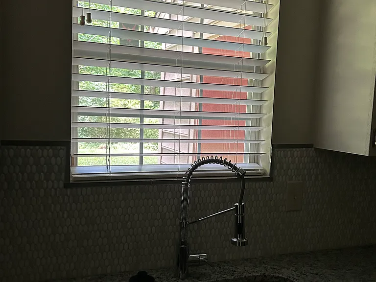 Kitchen double Sink with Window view of the backyard.