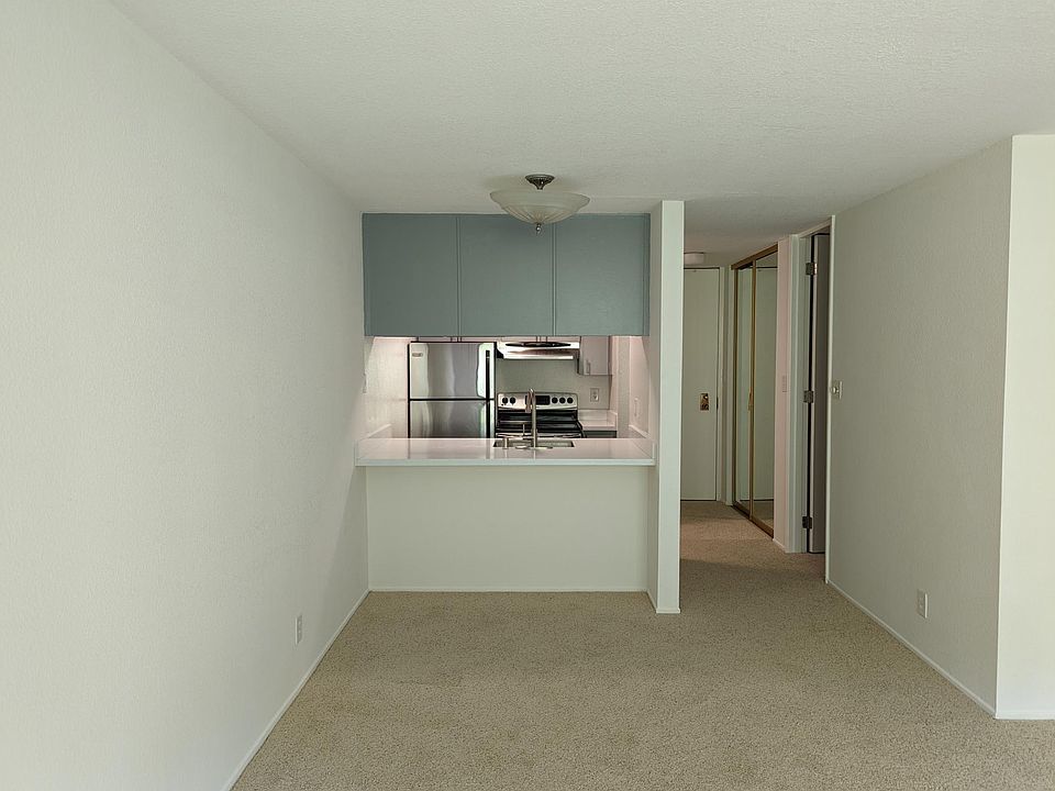 Facing kitchen from patio door. Entry hall, closet and bathroom to the right.