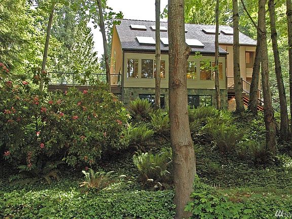Tucked away on a private drive in the heart of Mirrormont. A true RETREAT styled home.