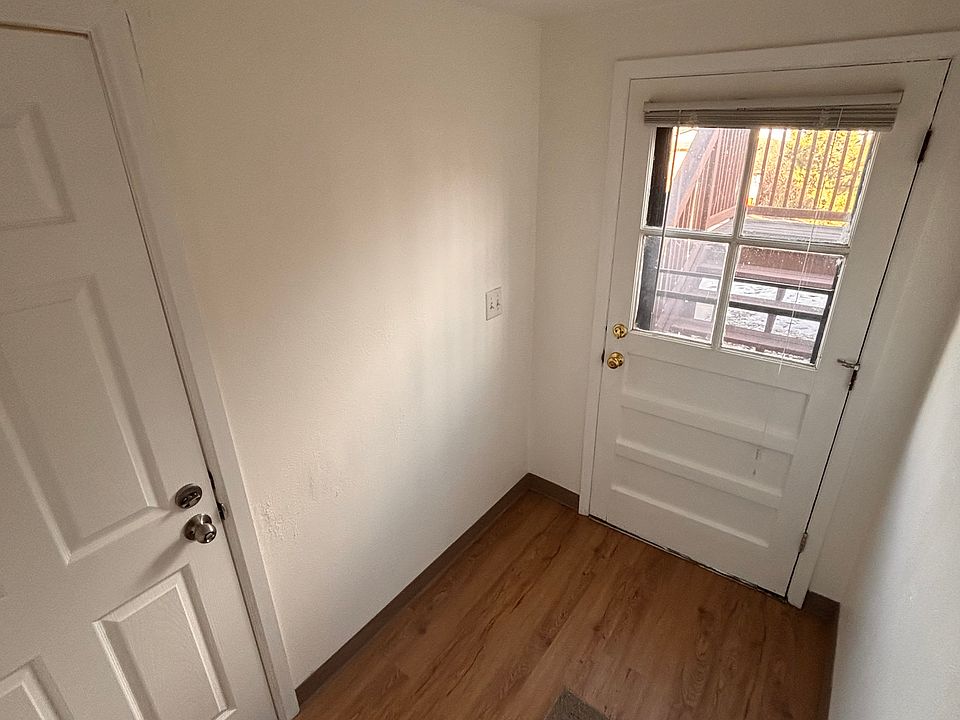 Laundry room to left, garage entrance, exit outside to right