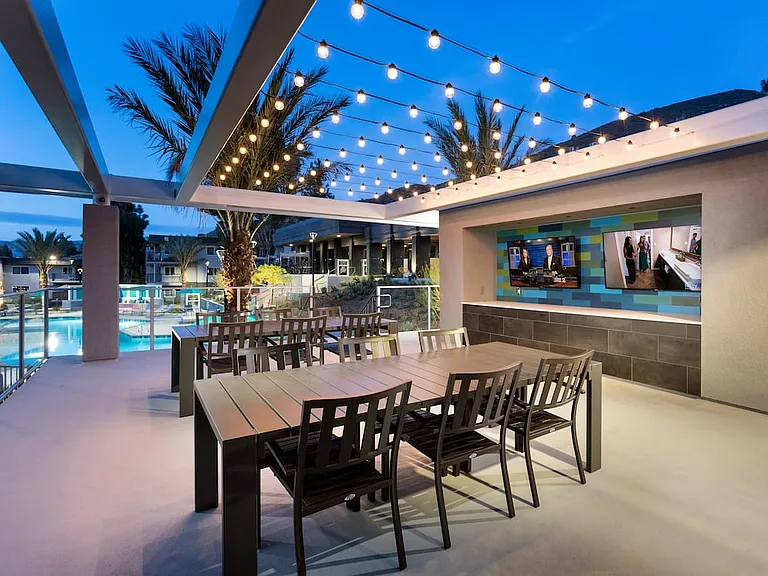 South Clubhouse sundeck with grills TVs and seating