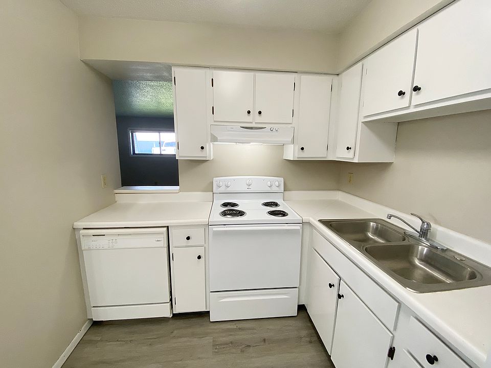 KITCHEN REFLECTING PASS THROUGH TO LIVING ROOM