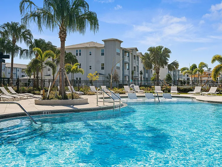 Relax in style at our tropical-inspired pool area, the perfect spot for leisure and luxury living.
