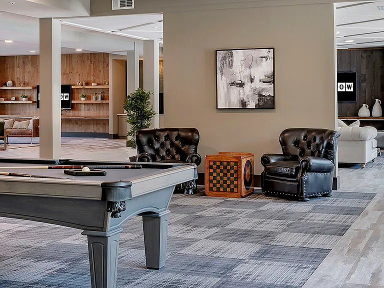 Experience luxury living in this sophisticated apartment lounge, perfect for relaxation and entertainment.
