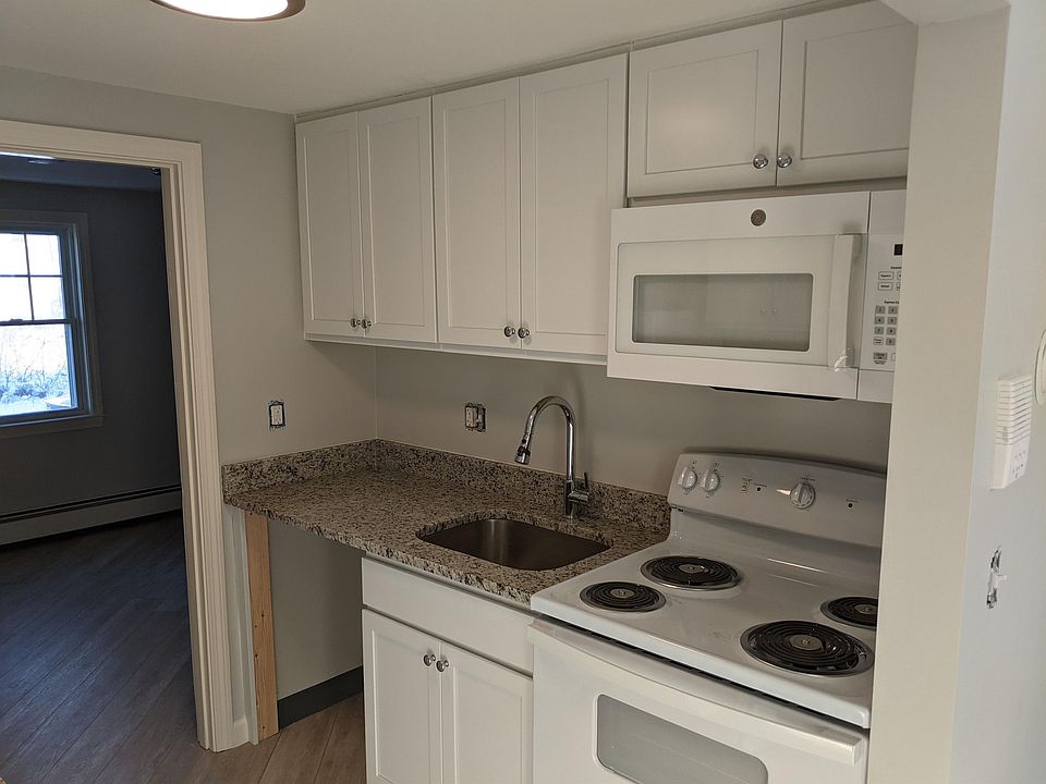 Kitchen with over the range Microwave, stove, granite and space for washer dryer (to be installed)
