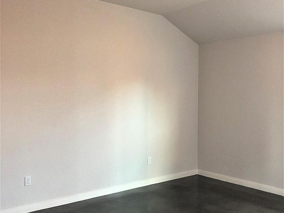 Vaulted ceilings (primary bdrm and living room) and fans in every room.