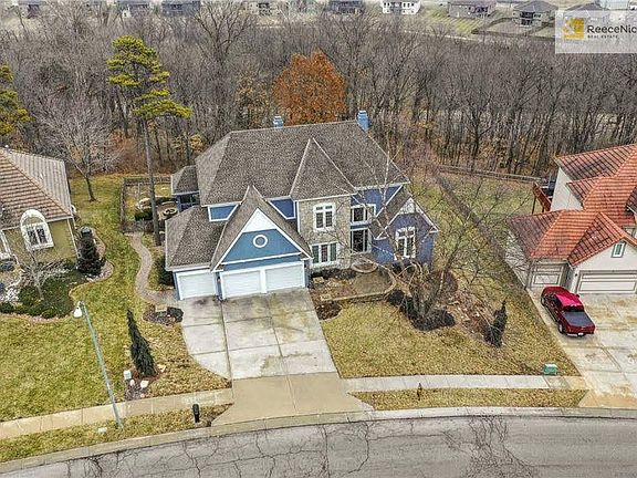 Aerial view of home backing to woods!