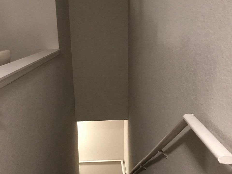 Stairs in apartment leading down to garage