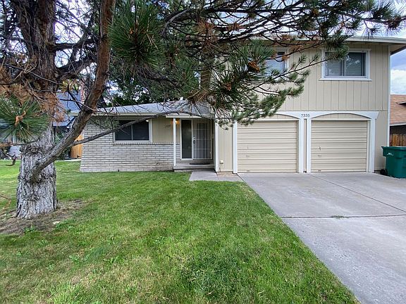 Front of home under tree