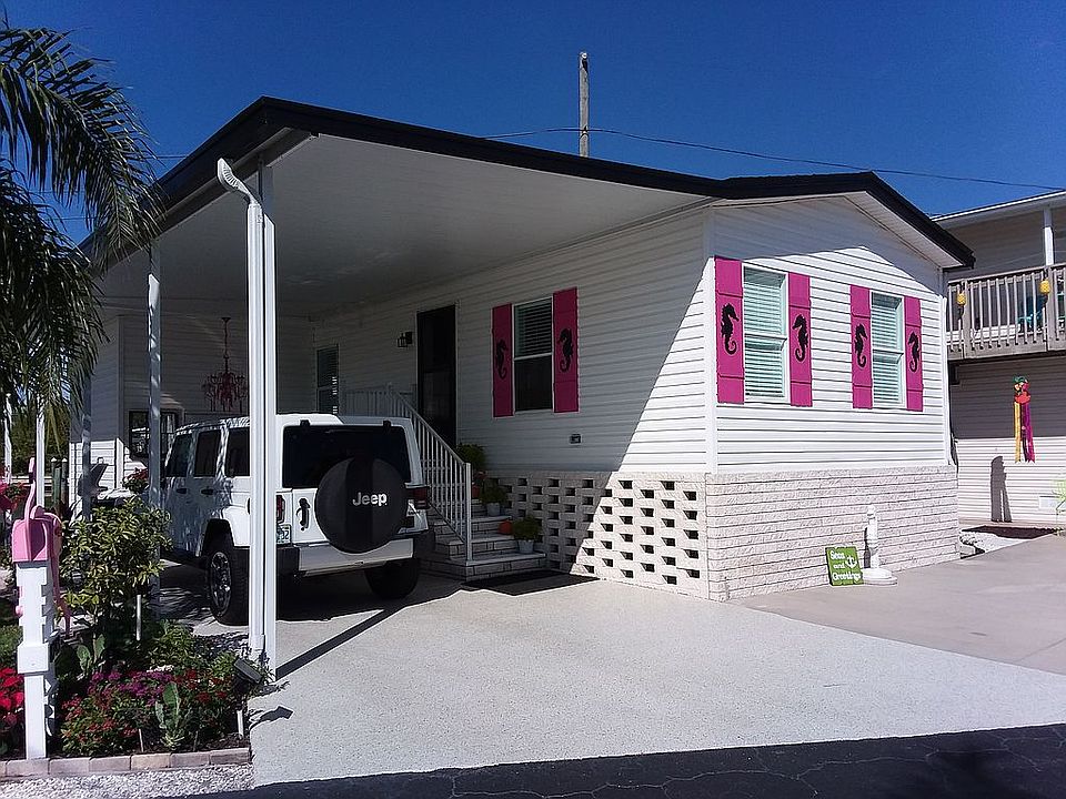 Front - tall carport fits 2 