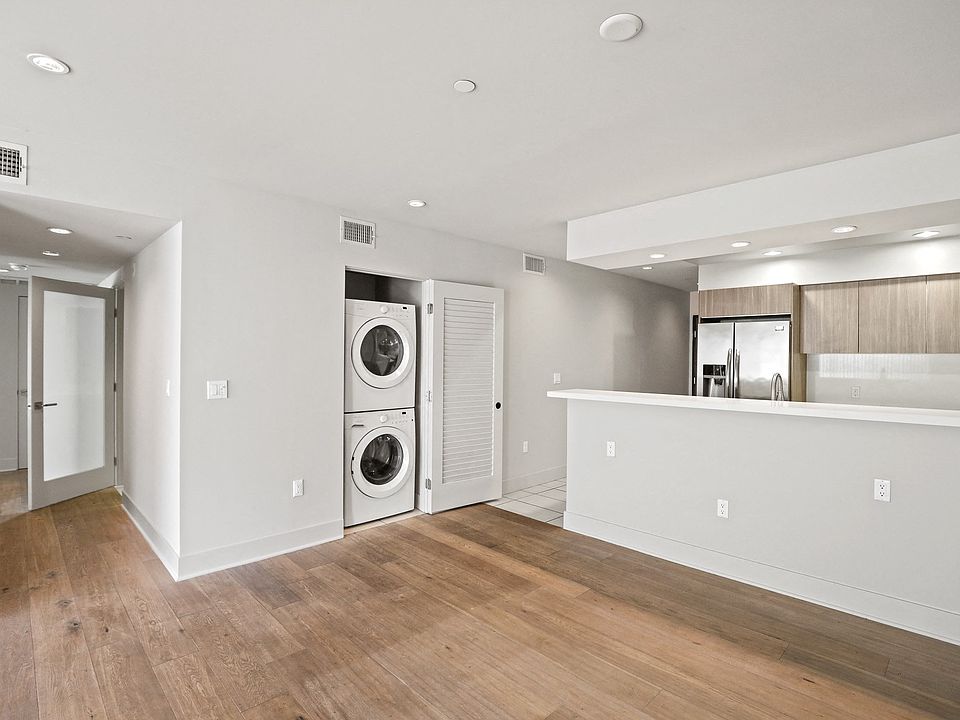 Open-Concept Kitchen and Dining Space with In-Suite Washer & Dryer